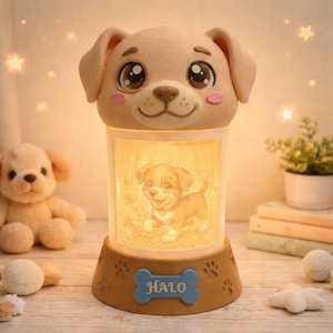 May include: A beige puppy-shaped night light with a smiling face and large eyes. The light has a rectangular center with a puppy image and the word "HALO" on a blue bone-shaped plaque. Paw prints decorate the base.