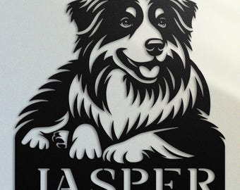 May include: Black and white silhouette of a Border Collie dog with the name "Jasper" underneath. The dog is lying down with its head turned to the side and its tongue sticking out.