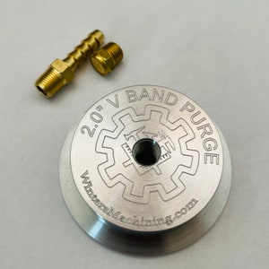May include: A silver 2.0" V-Band Purge with a gear-like design and the text "WintersMachining.com". The purge is accompanied by two brass fittings.