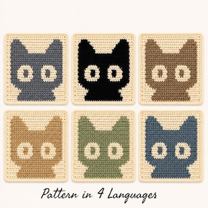 Può includere: Sei sottobicchieri quadrati all'uncinetto con un motivo a testa di gatto in diversi colori, tra cui grigio, nero, marrone, beige, verde e blu. Ogni sottobicchiere ha uno sfondo color crema con una sagoma di gatto a contrasto e grandi occhi.
