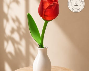 May include: A 3D printed red tulip flower with a green stem and leaf, placed in a small white vase. The image includes a circular badge with the text DIGITAL DOWNLOAD, STL + 3MF, and a downward arrow icon indicating a file download.