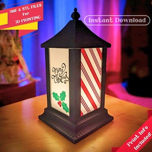 May include: A black and white 3D printable Christmas lantern with a red and white striped design and the words "Merry Christmas" on the front. The lantern is sitting on a wooden table. Instant Download. Print Info Included.