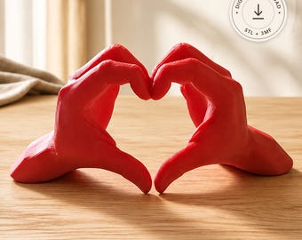 May include: A bright red sculpture of two hands forming a heart shape. The object features a smooth, matte finish and is positioned to create a central heart-shaped opening. A circular badge in the corner displays the text DIGITAL DOWNLOAD STL + 3MF.