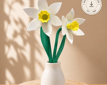 May include: A 3D printed model of two white and yellow daffodils with green stems in a small white vase. A circular badge in the upper right corner contains the text Digital Download, an arrow icon, and the labels STL + 3MF.