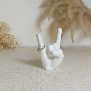 White devil horn hand sign ring holder made from concrete