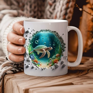 May include: White ceramic mug with a 3D design of a sea turtle swimming in an underwater scene. The scene is surrounded by a cracked, broken wall effect.