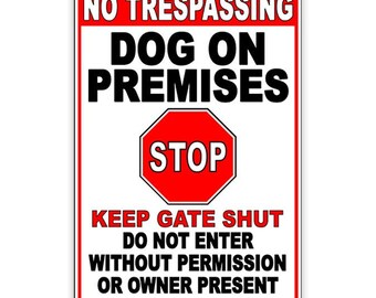 May include: White sign with red border and red stop sign. The sign reads "No Trespassing Dog on Premises Stop Keep Gate Shut Do Not Enter Without Permission or Owner Present".