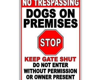 May include: Red and white sign with the text "NO TRESPASSING DOGS ON PREMISES" and a red stop sign with the text "STOP". The sign also says "KEEP GATE SHUT DO NOT ENTER WITHOUT PERMISSION OR OWNER PRESENT".