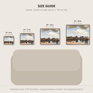 May include: A size guide graphic displaying four rectangular canvas prints of a cityscape painting above a 190 cm sofa. Sizes include 10x8 inches, 14x11 inches, 20x16 inches, and 24x20 inches. The text reads SIZE GUIDE and Canvas - shown to scale.