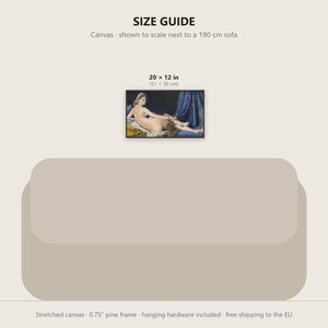 May include: A rectangular canvas print measuring 20 x 12 inches, featuring a classical painting of a reclining figure draped in blue fabric. The print is displayed above a 190 cm sofa graphic with a 0.75 inch pine frame and hanging hardware.