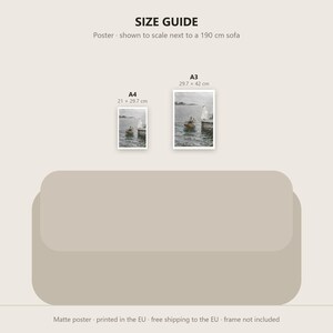 May include: A size guide graphic featuring two rectangular posters displayed above a 190 cm sofa. The A4 poster measures 21 x 29.7 cm, and the A3 poster measures 29.7 x 42 cm. Both posters depict a small boat on water near a dock.
