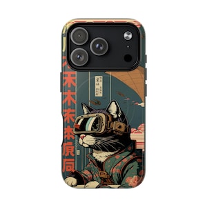 May include: A phone case featuring a black cat wearing VR goggles, set against a backdrop of Japanese-inspired art. The case has a colorful design with Japanese text and a vintage aesthetic.