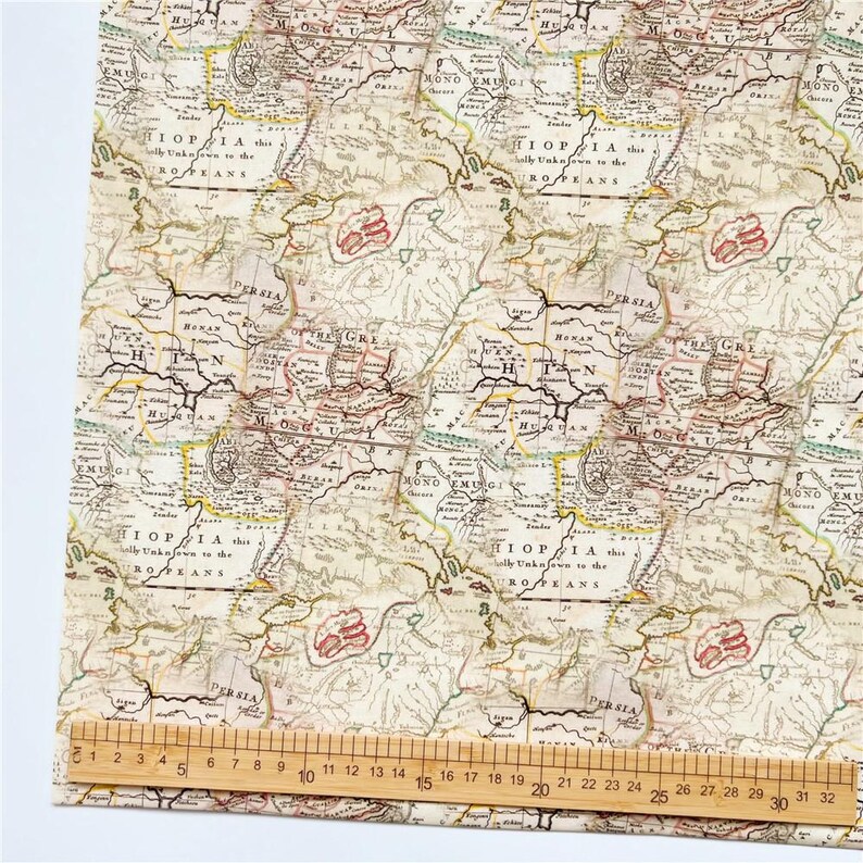 May include: A vintage map pattern fabric with a beige background and brown, red, and yellow lines. The map features the text "HIOPIA, this is wholly unknown to the ROTEANS" and "PERSIA".