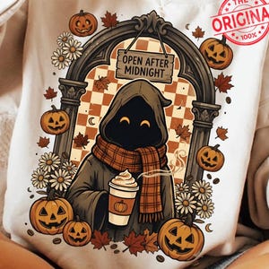 May include: A beige crewneck sweatshirt featuring a graphic of a hooded figure in a plaid scarf holding a coffee cup. The design includes an arched doorway, the text "OPEN AFTER MIDNIGHT," jack-o'-lanterns, daisies, and autumn leaves.