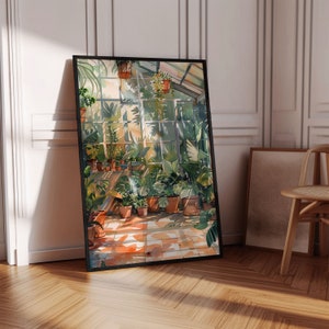 Puede incluir: Una impresi&oacute;n en acuarela enmarcada representa el interior soleado de un invernadero. La obra de arte muestra varias plantas en macetas, con la luz del sol entrando por grandes ventanas. La paleta de colores incluye verdes, marrones y naranjas, creando un ambiente c&aacute;lido. La impresi&oacute;n est&aacute; apoyada contra una pared blanca.