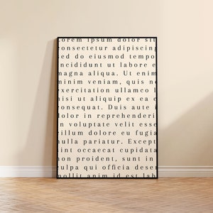 Puede incluir: Un póster enmarcado en negro con fondo blanco y texto negro. El texto es una cita del texto latino "Lorem ipsum dolor sit amet".