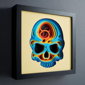 May include: A colourful papercraft skull with a layered design in shades of blue, red, yellow, and orange. The skull is framed in a black frame.