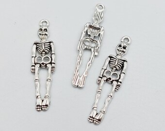 50 Skeleton Charms in Silver Tone BULK - (Halloween Bones skull boneman reaper gothic pendant grim charm) - KAO1