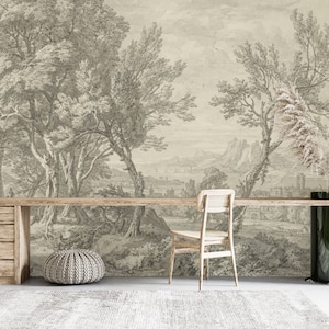 Puede incluir: Un dibujo en blanco y negro de un paisaje con árboles, montañas y una masa de agua. El dibujo está impreso en una pared y un escritorio de madera está delante.