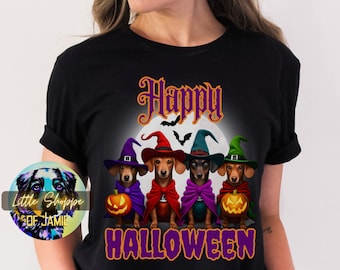 May include: Black t-shirt with a graphic of four dachshund dogs wearing witch hats and holding pumpkins. The text "Happy Halloween" is printed below the dogs.