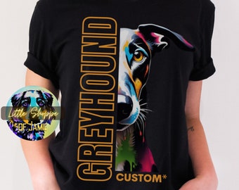 May include: Black t-shirt with a colorful illustration of a Greyhound dog's face and the word "GREYHOUND" in orange text. The text "CUSTOM*" is also visible on the shirt.