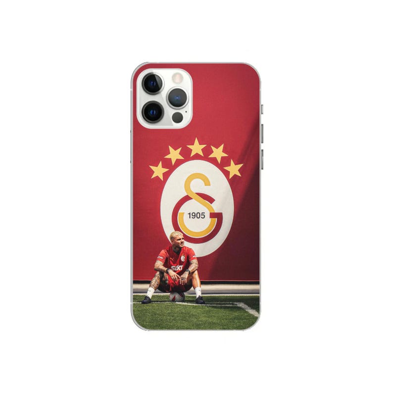 May include: A phone case featuring a red background with a Galatasaray logo and a photo of a soccer player. The logo includes a gold 'G' and the year '1905'. The player is wearing a red jersey and sitting on the field.