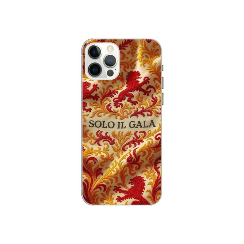 May include: A phone case featuring a repeating pattern of red lions and gold filigree on a cream background. The case has a clear camera lens opening and the text "SOLO IL GALA" is visible.