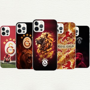 May include: A collection of phone cases featuring the Galatasaray football club logo and imagery. Designs include a roaring lion, the team's emblem, and a player. The cases are in red, black, and gold.