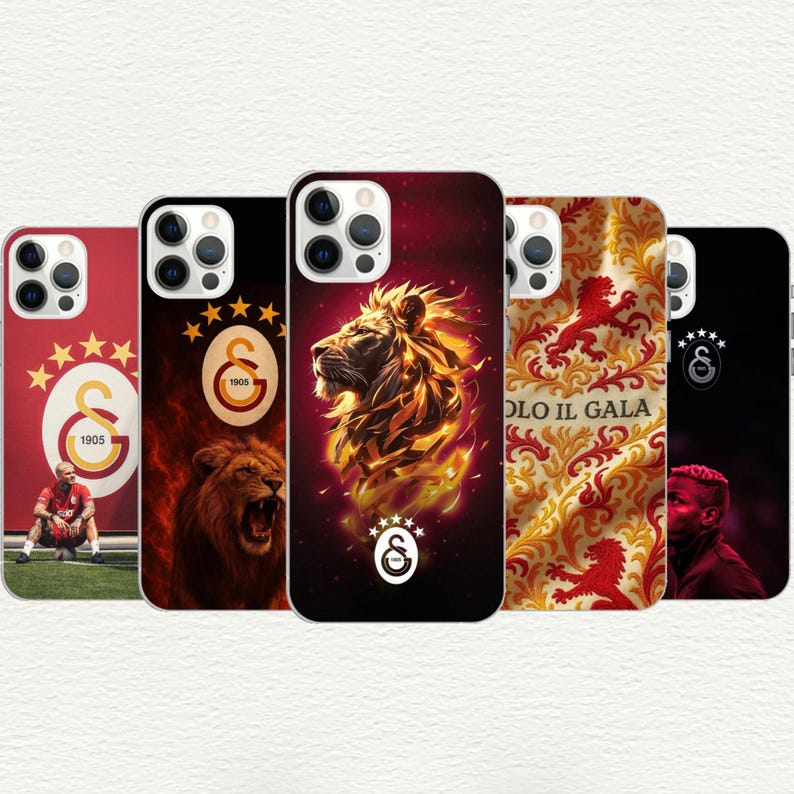 May include: A collection of phone cases featuring the Galatasaray football club logo and imagery. Designs include a roaring lion, the team's emblem, and a player. The cases are in red, black, and gold.