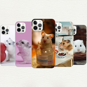 May include: A collection of five smartphone cases featuring various hamster designs. The cases display images of hamsters in different settings, including a hamster inside a glass jar, a hamster wearing glasses, and hamsters near food items.