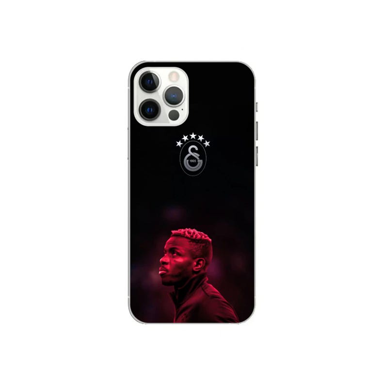 May include: Black phone case featuring a portrait of a man in profile, set against a dark background. The Galatasaray logo is displayed at the top, with a silver border. The case is designed for a smartphone.