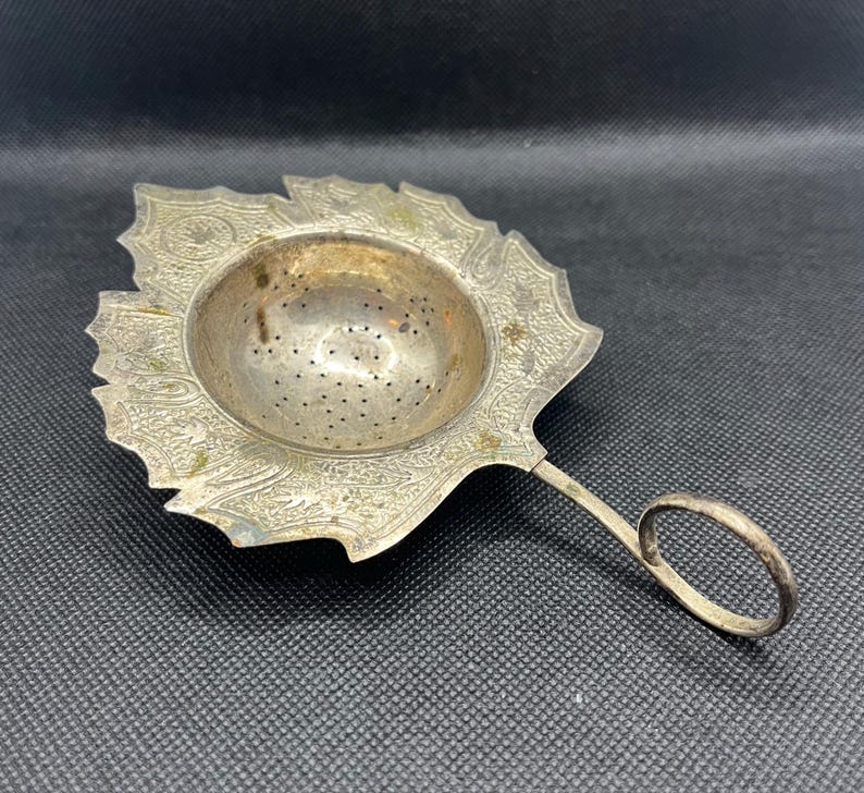 Vintage silverplate maple leaf shaped tea strainer ornate floral loop handle, vintage home decor