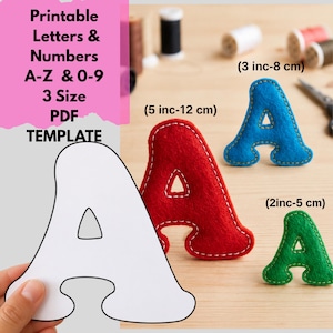 May include: A printable PDF template for letters and numbers A-Z and 0-9 in three sizes. The image shows a white paper cutout of the letter A, alongside three felt letter A shapes in red, blue, and green, labeled with sizes 2, 3, and 5 inches.