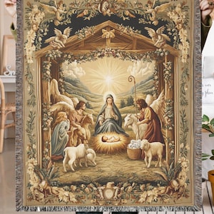 May include: A tapestry depicting the Nativity scene with Mary, Joseph, and the baby Jesus in a manger. Angels and shepherds surround the scene, with a star shining brightly above. The tapestry is framed by a wooden structure and adorned with floral details.