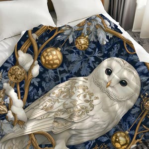 May include: A white owl with gold accents sits on a branch with blue and gold leaves. The owl is surrounded by gold ornaments and snow. The background is a dark blue.