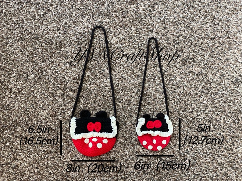 May include: Two crochet crossbody bags. The larger bag is 8 inches (20 cm) wide and 6.5 inches (16.5 cm) tall, and the smaller bag is 6 inches (15 cm) wide and 5 inches (12.7 cm) tall. Both bags are red with white polka dots and black tops with a red bow.
