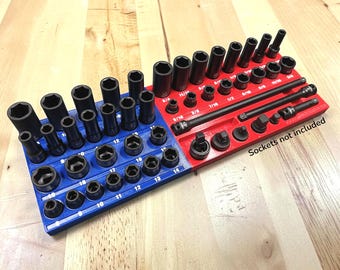 May include: A red, white, and blue socket organizer with various black sockets. The organizer is divided into sections, with sizes labeled in inches. The text "Sockets not included" is visible.