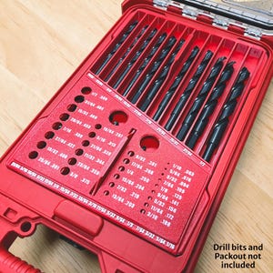 May include: A red plastic drill bit organizer case featuring labeled slots for various drill bit sizes ranging from 1/16 inch to 1/2 inch. The case includes a clear lid and a red interior tray with printed fractional and decimal measurements.