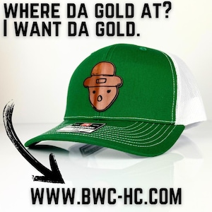 May include: Green and white trucker hat with a brown leather patch of a cartoon leprechaun. The text "WHERE DA GOLD AT? I WANT DA GOLD." is at the top of the image. The text "WWW.BWC-HC.COM" is at the bottom of the image.