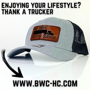 May include: Gray and black trucker hat with a brown leather patch that says "We Drive So You Survive" and a silhouette of a semi-truck. The website www.bwc-hc.com is printed below the hat.