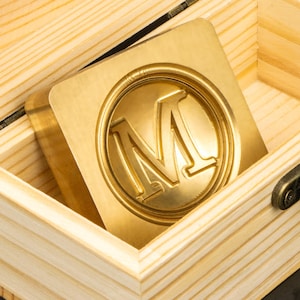 May include: A trio of ceramic mugs with a speckled, matte finish in cream, light grey, and dark grey. Each mug features a simple, minimalist design, ideal for tea or coffee.