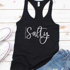 May include: Black tank top with the text "Salty" in white cursive font and the text "Matthew 5:13" in smaller white font.