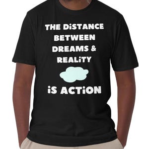 The Distance Between Dreams & Reality is Action Quote T-Shirt: Motivational Unisex and Women&#39;s Cotton Tee