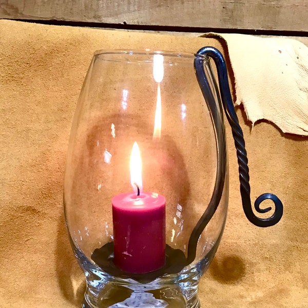 Hand forged metal candle holder in Hurricane glass, made in Montana