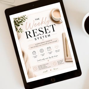 May include: A digital tablet displaying a document titled The Weekly Reset System. The page features text, icons for a home, brain, calendar, and heart, and sections outlining a weekly routine for a cleaner home, calmer mind, and planned week.