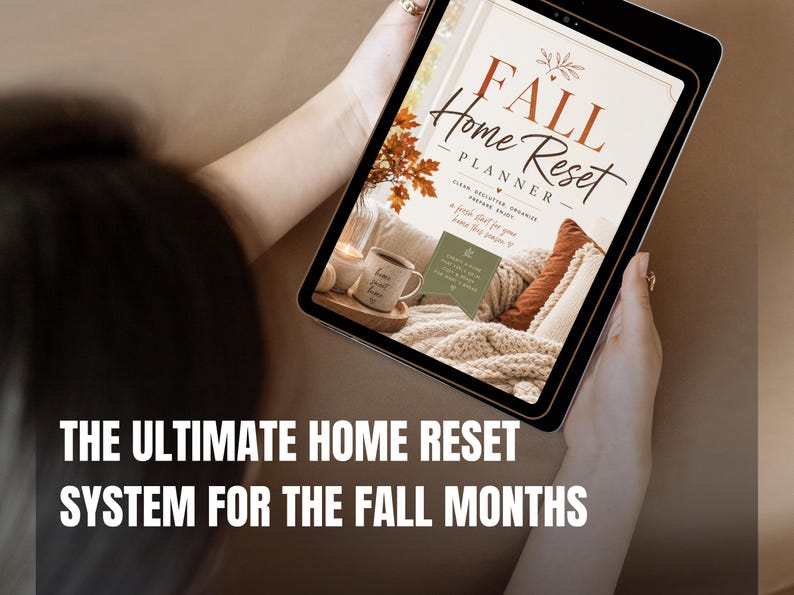 May include: A digital tablet displaying a planner cover titled Fall Home Reset Planner. The design features warm autumn colors, a cozy interior scene with a mug, and text that reads Clean, Declutter, Organize, Prepare, Enjoy, a fresh start for your home this season.