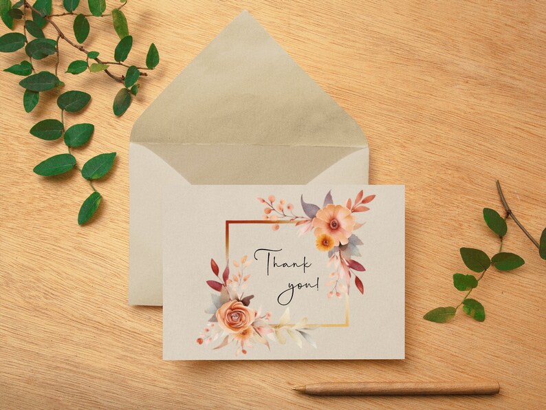 Puede incluir: Una tarjeta de agradecimiento con un dise&ntilde;o floral de acuarela en tonos naranja, rosa y marr&oacute;n. Las flores est&aacute;n dispuestas en un marco cuadrado con un borde dorado. El texto "&iexcl;Gracias!" est&aacute; escrito en cursiva negra.
