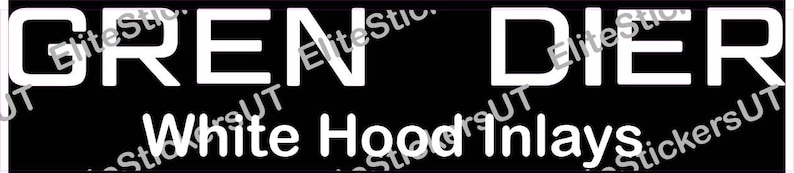May include: White on black sticker with the text "GREN DIER" and the words "White Hood Inlays" below.