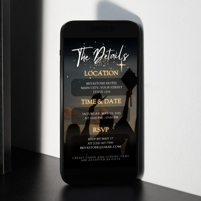 May include: A smartphone displays a graduation announcement with the text "The Details." The announcement includes the location, time, date, and RSVP information. The background features silhouettes of graduates and a sunset.