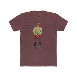 May include: Maroon t-shirt with a vintage illustration of a military figure. The figure is depicted in a light green jacket, red trousers, and black boots, in a retro comic book style.